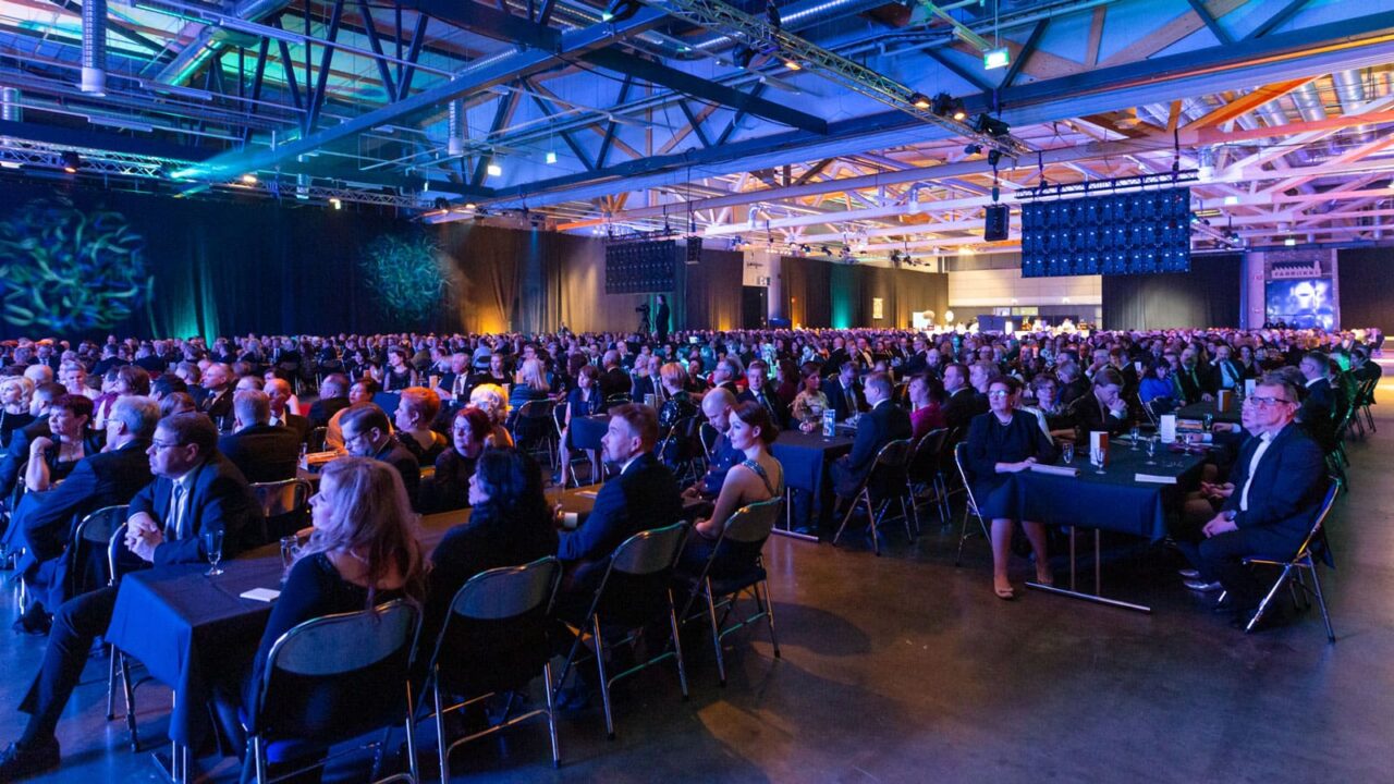 Persons sitting in an audience in Paviljonki.