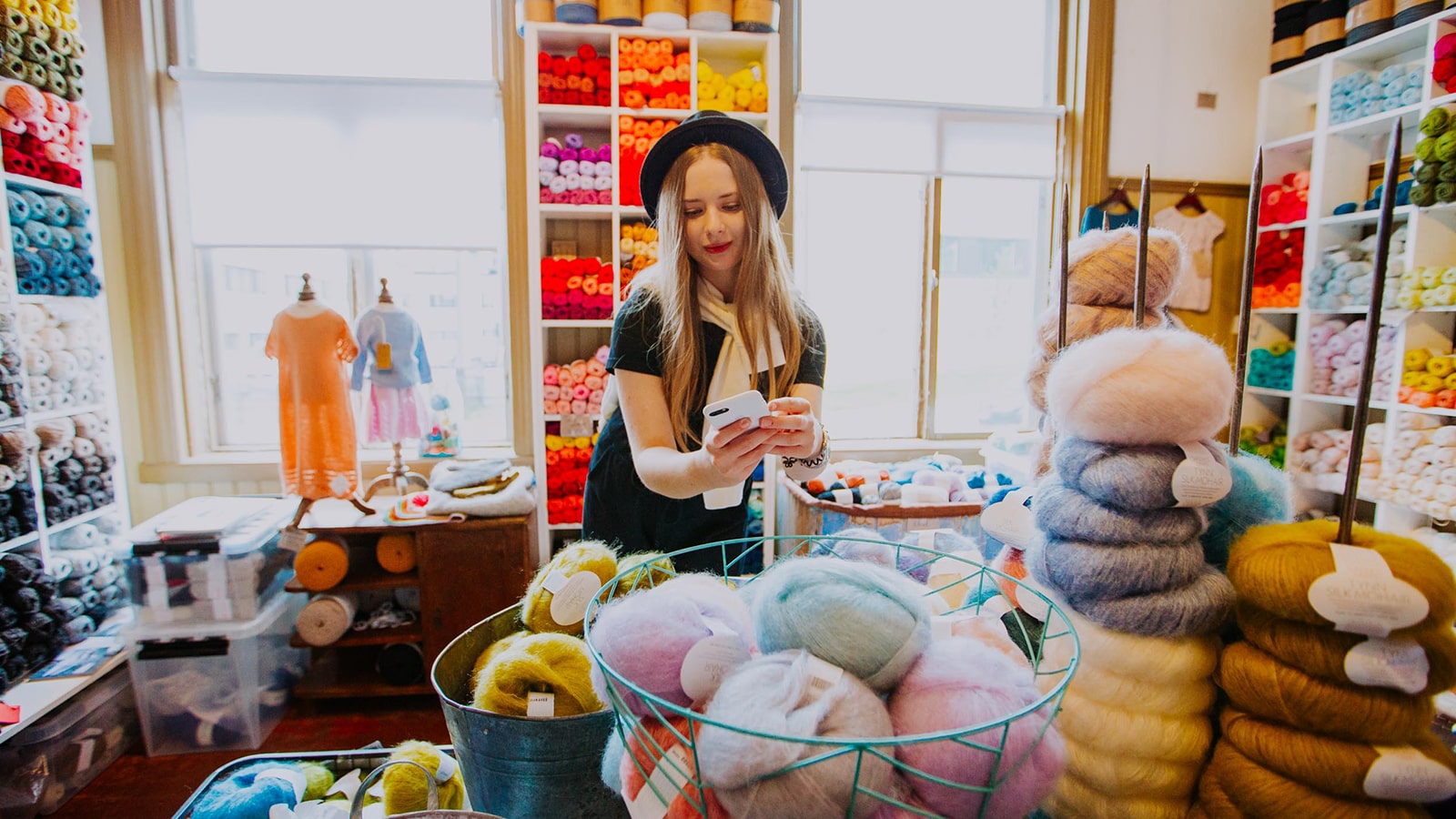 Person looking at the products at Titityy yarn shop