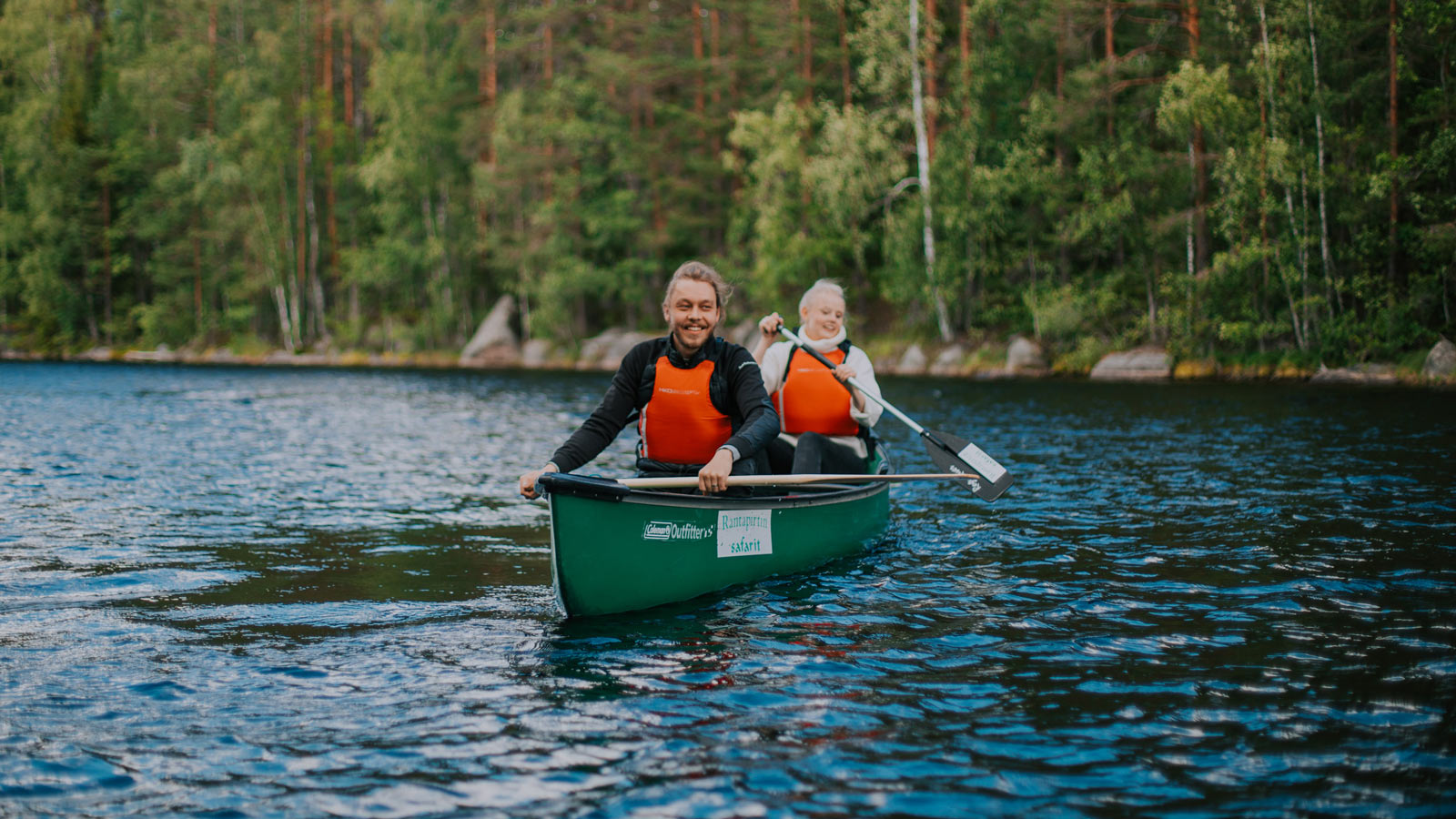 Two persons paddling in the Isojärvi National Park