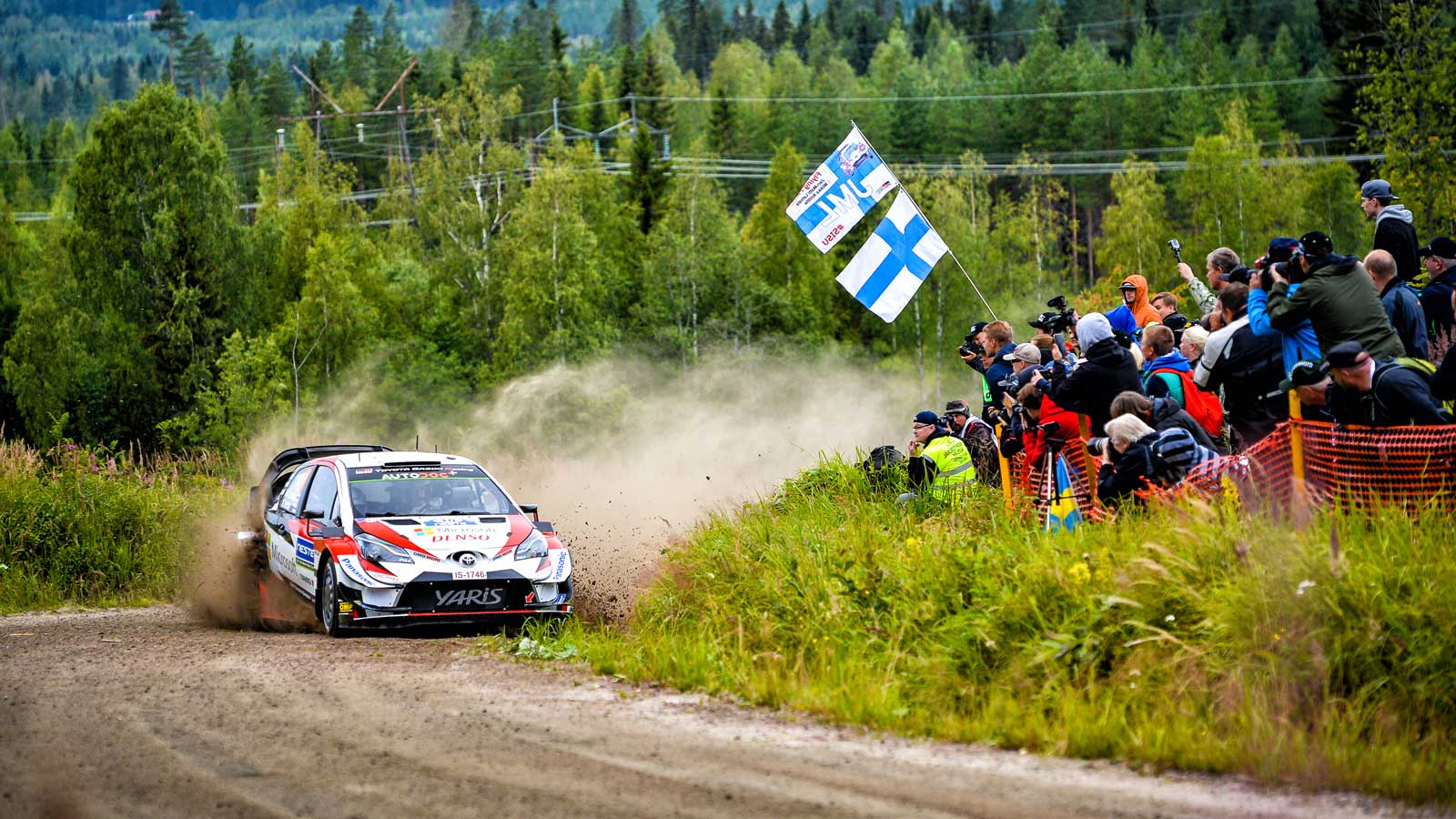 A racing car and some audience at the Rally Finland Event