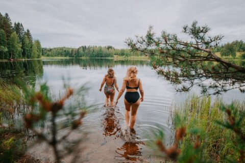 Two persons walking on the beach