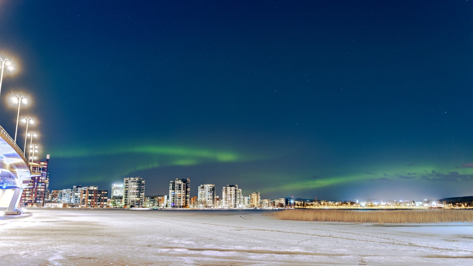 Northern Lights over the city skyline.