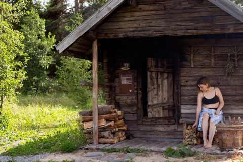 Person sitting on a sauna terrace