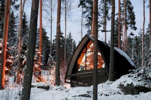 Charming Forest hut accommodation of Luontovire at dusk.