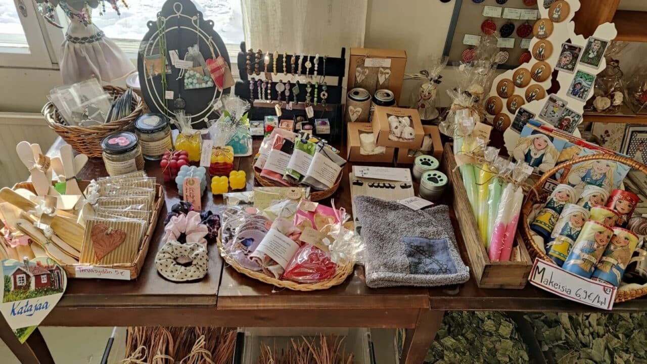A close-up of the handicraft products on sale, such as candles and sweets.