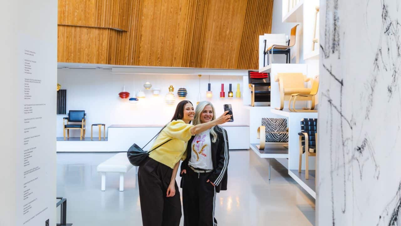 Two people take a selfie at the Aalto2 Museum Centre.