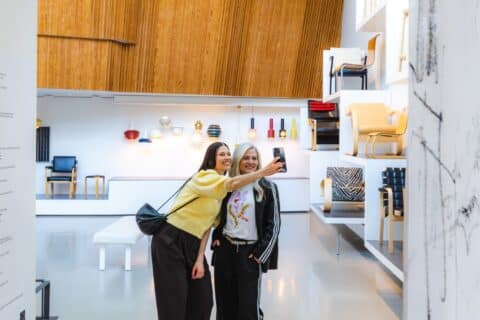 Two people take a selfie at the Aalto2 Museum Centre.