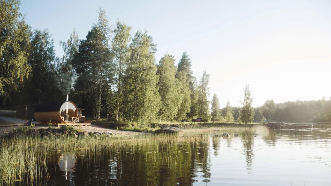 The sauna and lake are bathed in wonderful summer light.