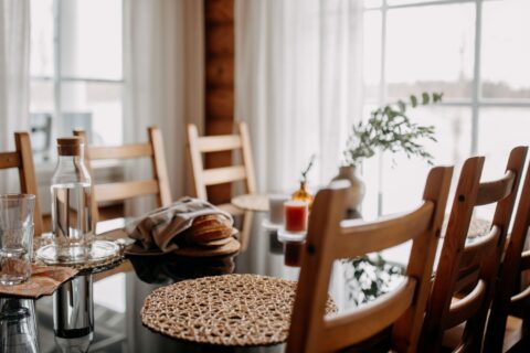 A dining table and a view outside to the lake.
