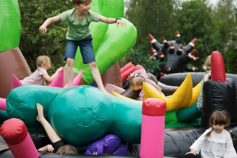 Children playing in the bouncy castle at the Haihatus Art Center.