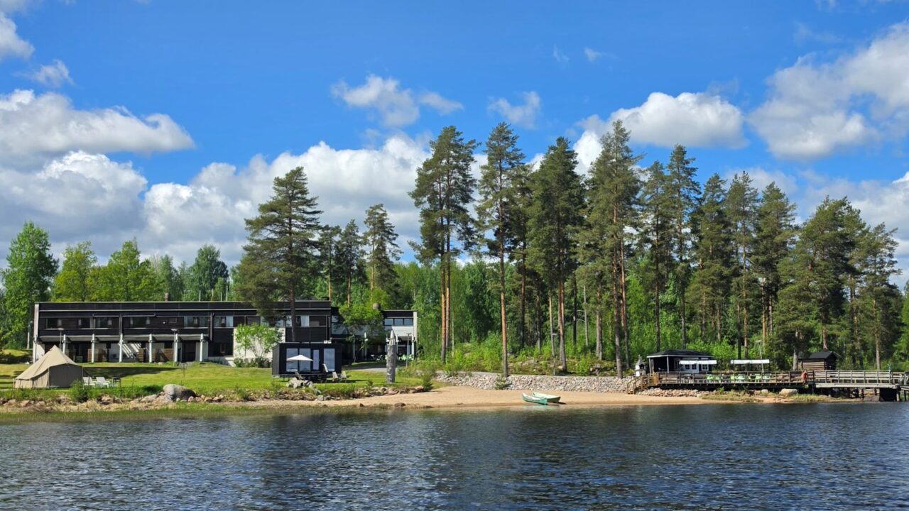 A hotel situated on the shores of a lake.