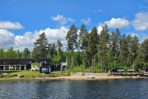 A hotel situated on the shores of a lake.